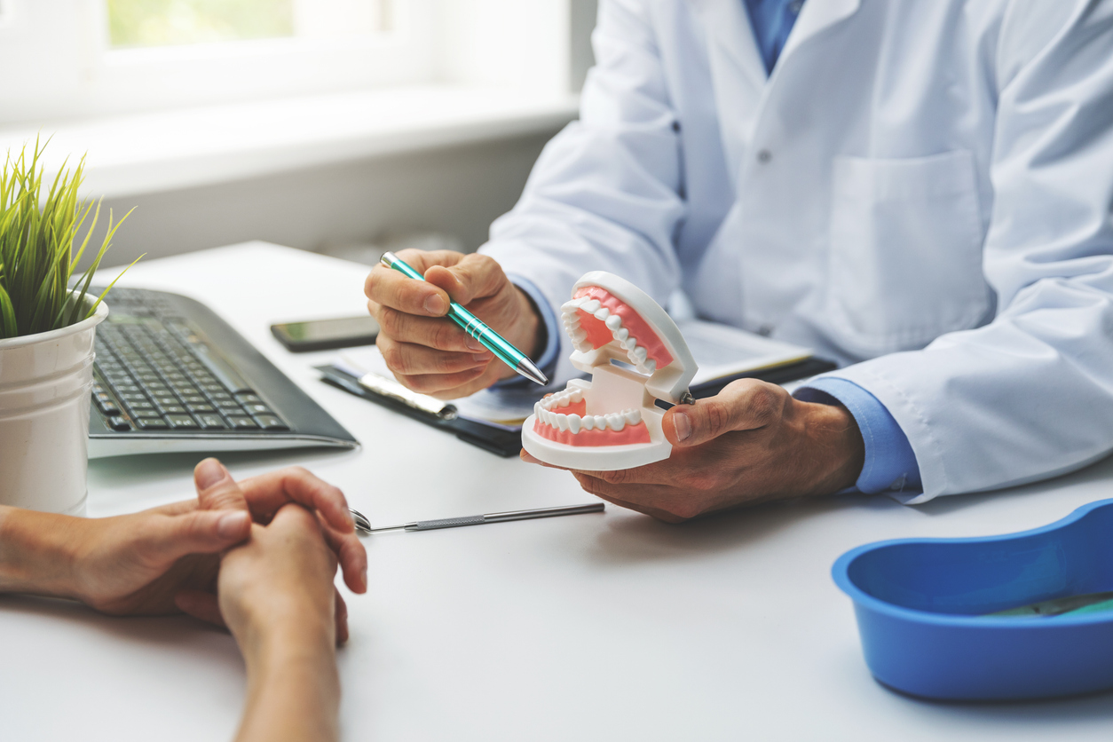 Dentist and patient discuss treatment plan | Trillium Dental